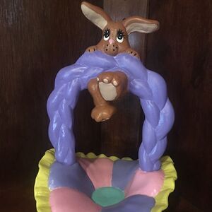 Ceramic Easter bunny hanging from basket